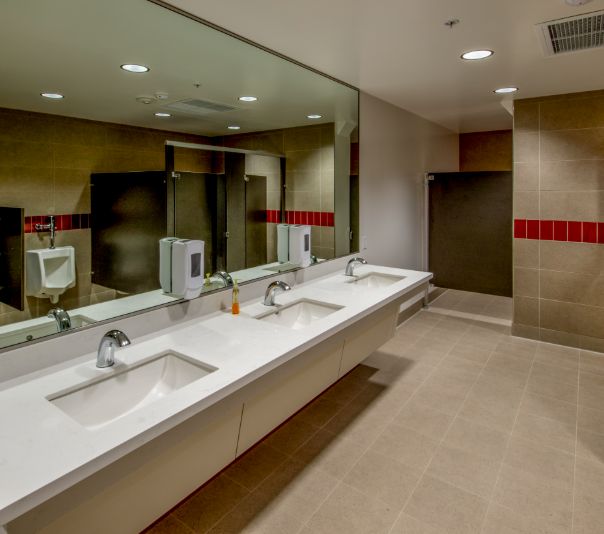 Modern, clean public restroom with multiple sinks and mirrors.