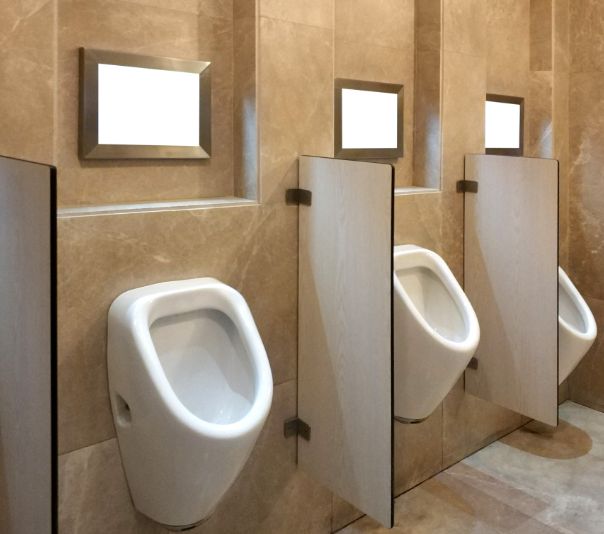 Clean public restroom with multiple urinals and privacy dividers.