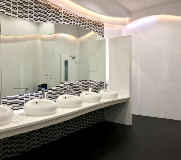 Modern bathroom with sleek sinks and large mirrors.